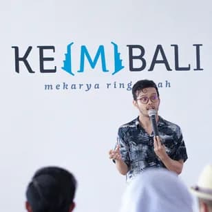A Chykalophia founder presenting on stage to an audience